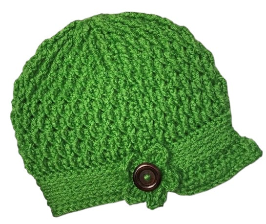 Kim the Happy Crafter handmade spring green crochet newsboy hat with a flower detail and brown wooden button.