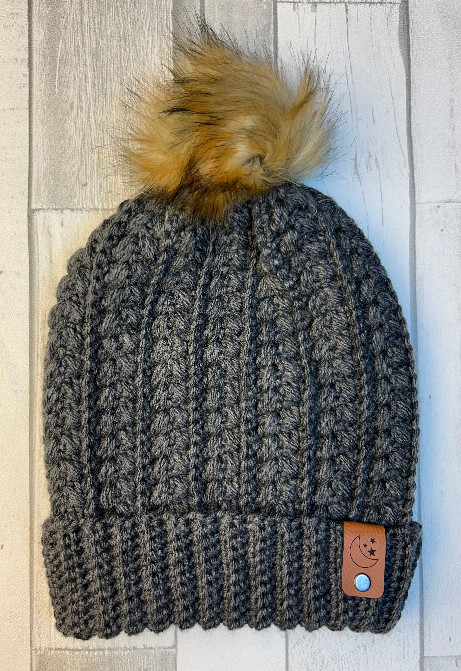 Snowy Wheat Beanie - Grey Heather with faux fur pom, ribbed knit, and leather patch.