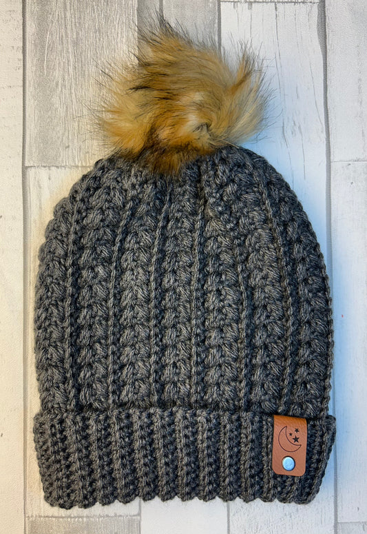 Snowy Wheat Beanie - Grey Heather with faux fur pom, ribbed knit, and leather patch.