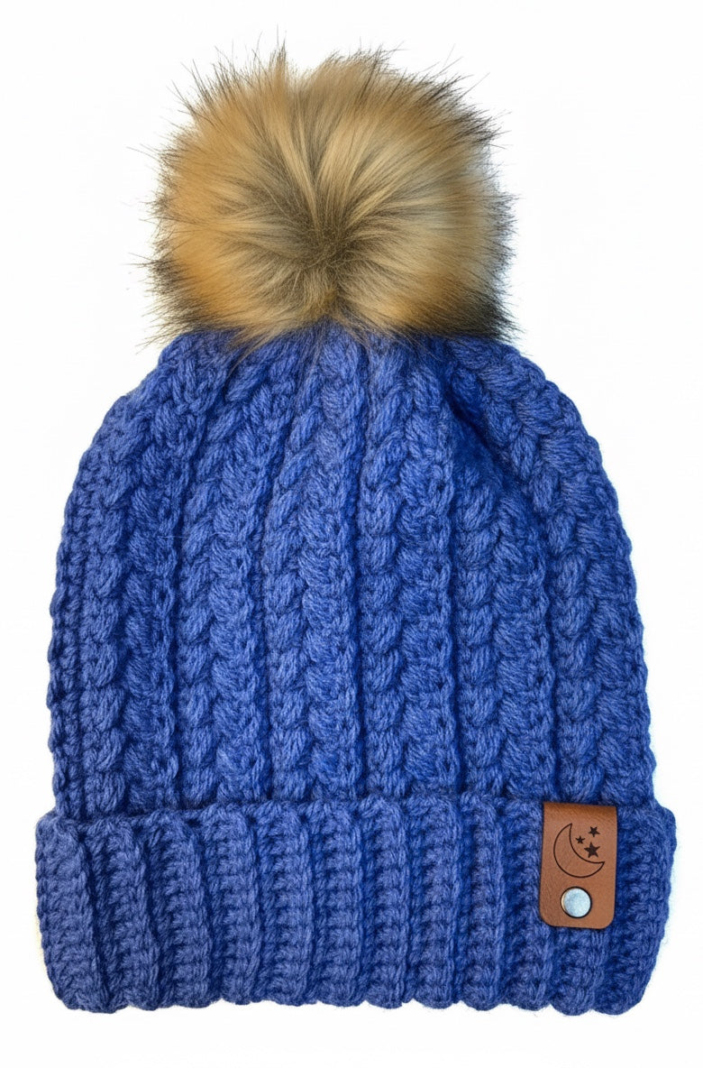 Kim the Happy Crafter denim blue crochet beanie with wheat stitch texture, fold-up brim, and faux fur pom pom.